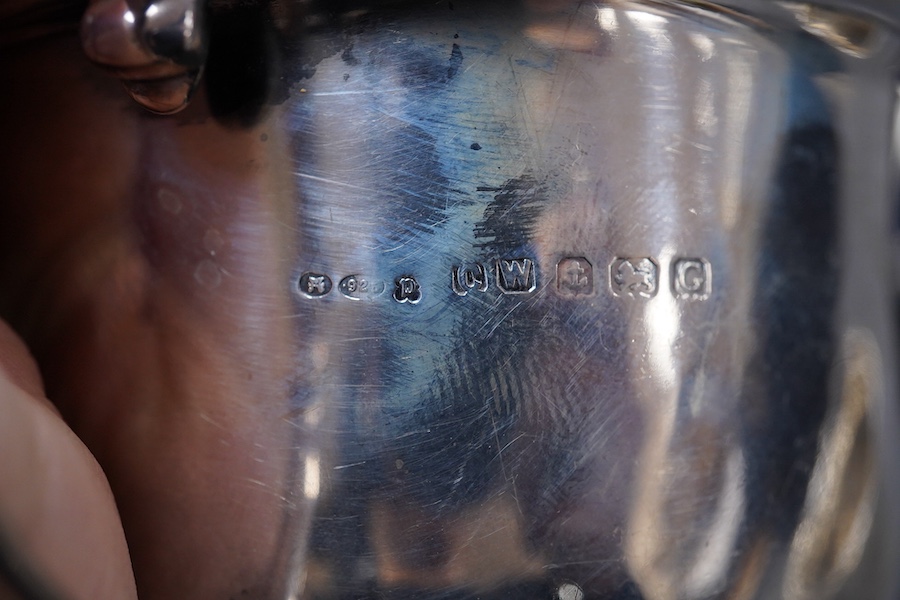 A George V Britannia standard silver mug, by Thomas Bradbury & Sons, Sheffield 1918, height 65mm, handle a.f., together with a 1930's silver porringer and a George V cased silver christening bowl and spoon, 13.2OZ.